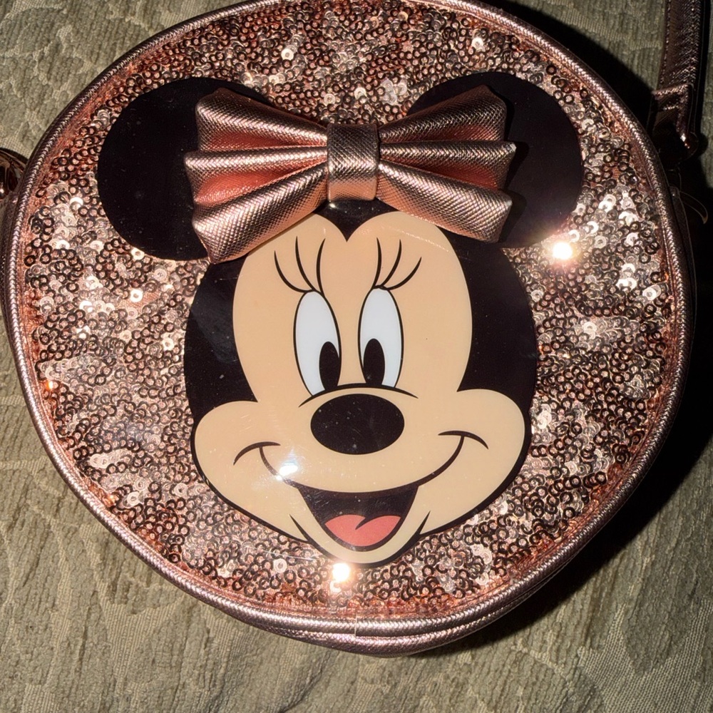 Walt Disney World Minnie Mouse Girls Rose Gold round purse with strap.